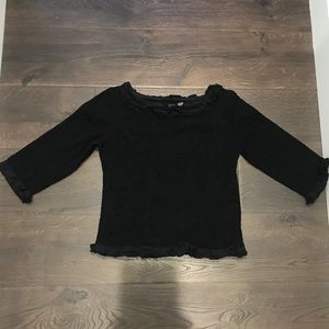 Nick and Mo black long sleeve shirt.
